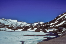 Mt. Conness over a frozen Ellery Lake