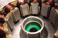 Motor stator and case showing cracked bearing cup.