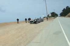 Motorcycle cops ready to join the caravan at the Santa Cruz County line.