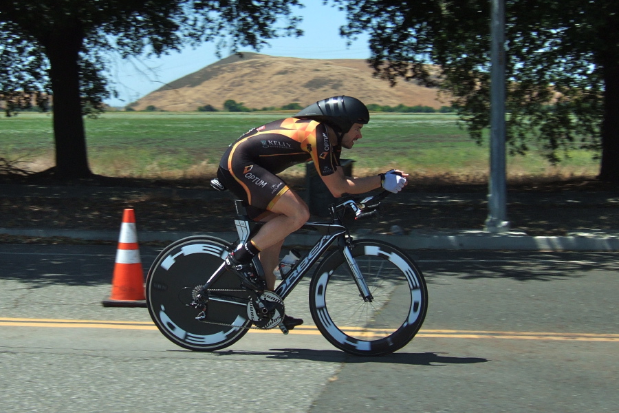 Optum Kelly rider in long tail time trial helmet