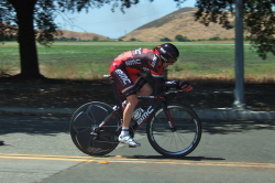 BMC rider slips by wearing a stub-tail time trial helmet.