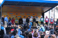 The Governator slips the golden jersey on Levi Leipheimer (Prologue winner)