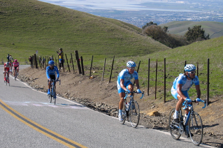 Rene Haselbacher leads his teammate to the summit of Sierra Rd.