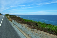 Riding south on CA1; view of Scott Creek Beach below in the distance.