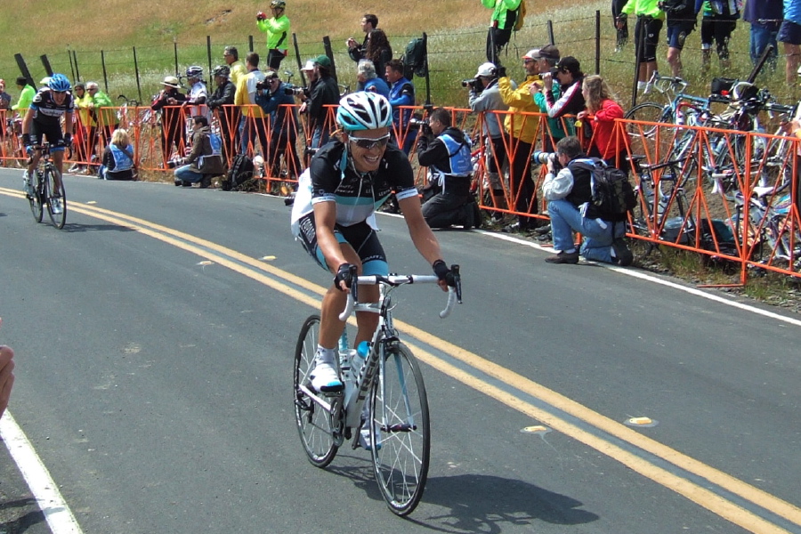 Linus Gerdemann smiles (or grimaces) for the cameras at the finish.