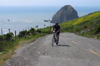Cyclists climb The Wall in front of Sugarloaf Island. (320ft)