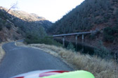 The bridge spans the Tuolumne River, which at this point of its course an arm of Don Pedro Reservoir.