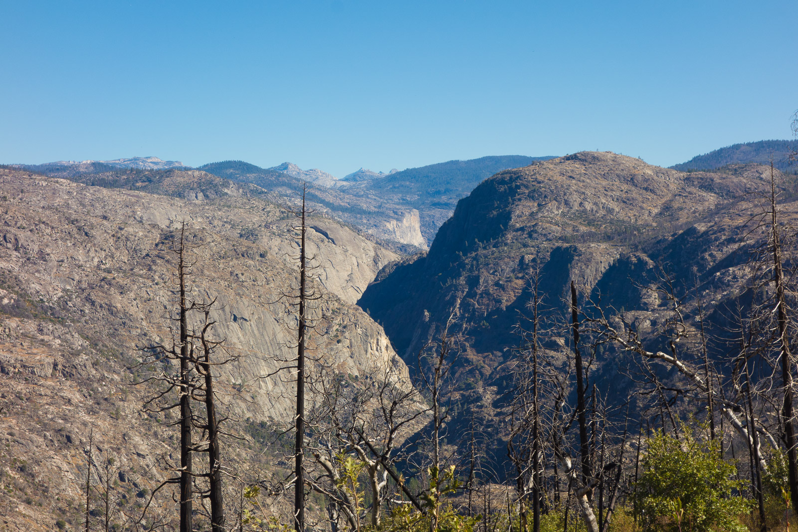 A corner of Hetch Hetchy Valley can be seen at the center distance.