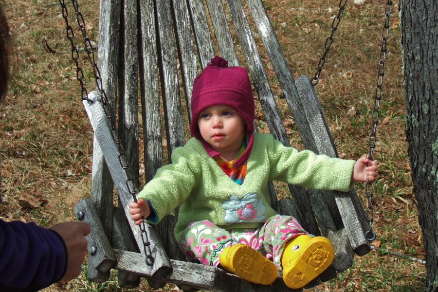 Natalie tries out a swing.