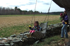 Camille enjoys a swing.