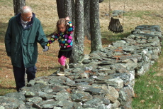 Camille learns to walk on the clinkers, assisted by her great-uncle David.