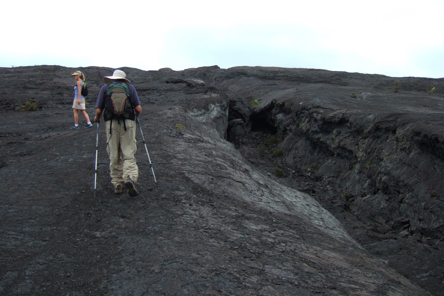Laura and David climb alongside a lava trench on Mauna Ulu.