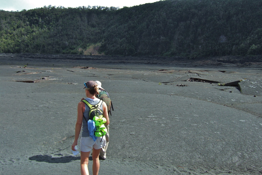 Laura and David walk across the pahoehoe at the bottom of Kilauea Iki.