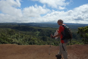 David peers down the ridge in the direction of Wai'ale'ale in the clouds.