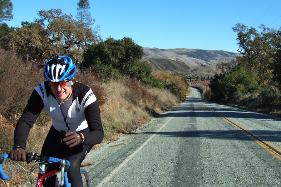 A rider climbs the first hill on Cienega Road.
