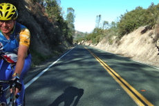 This cyclist is happy to reach the top of Bear Valley Grade.