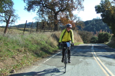 A rider crests the second climb on Cienega Road.