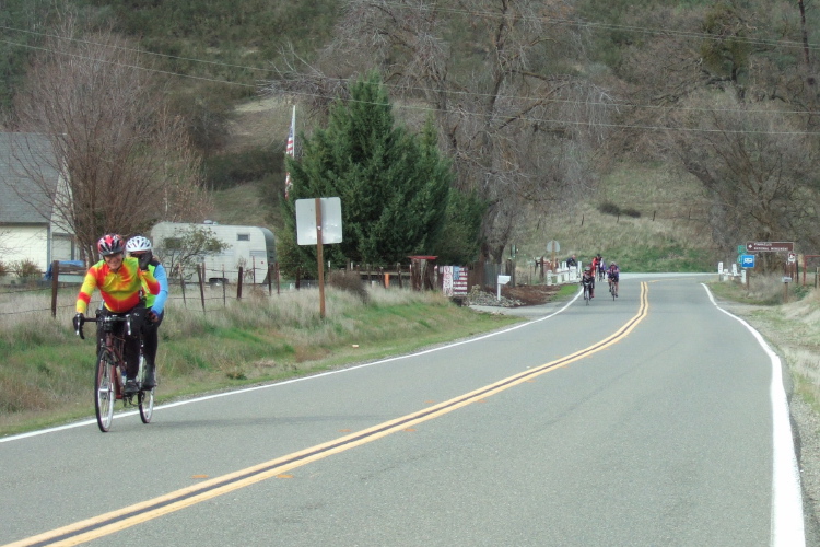 Cyclists riding across Bear Valley. (1)